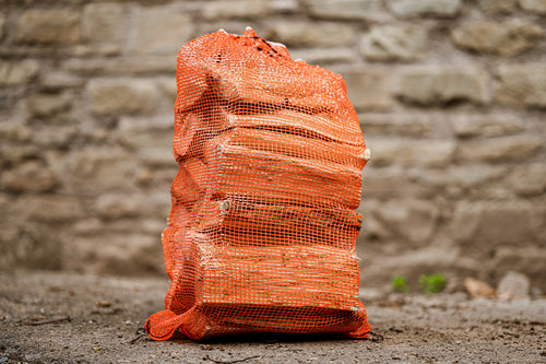 Net sack of kiln dried firewood logs